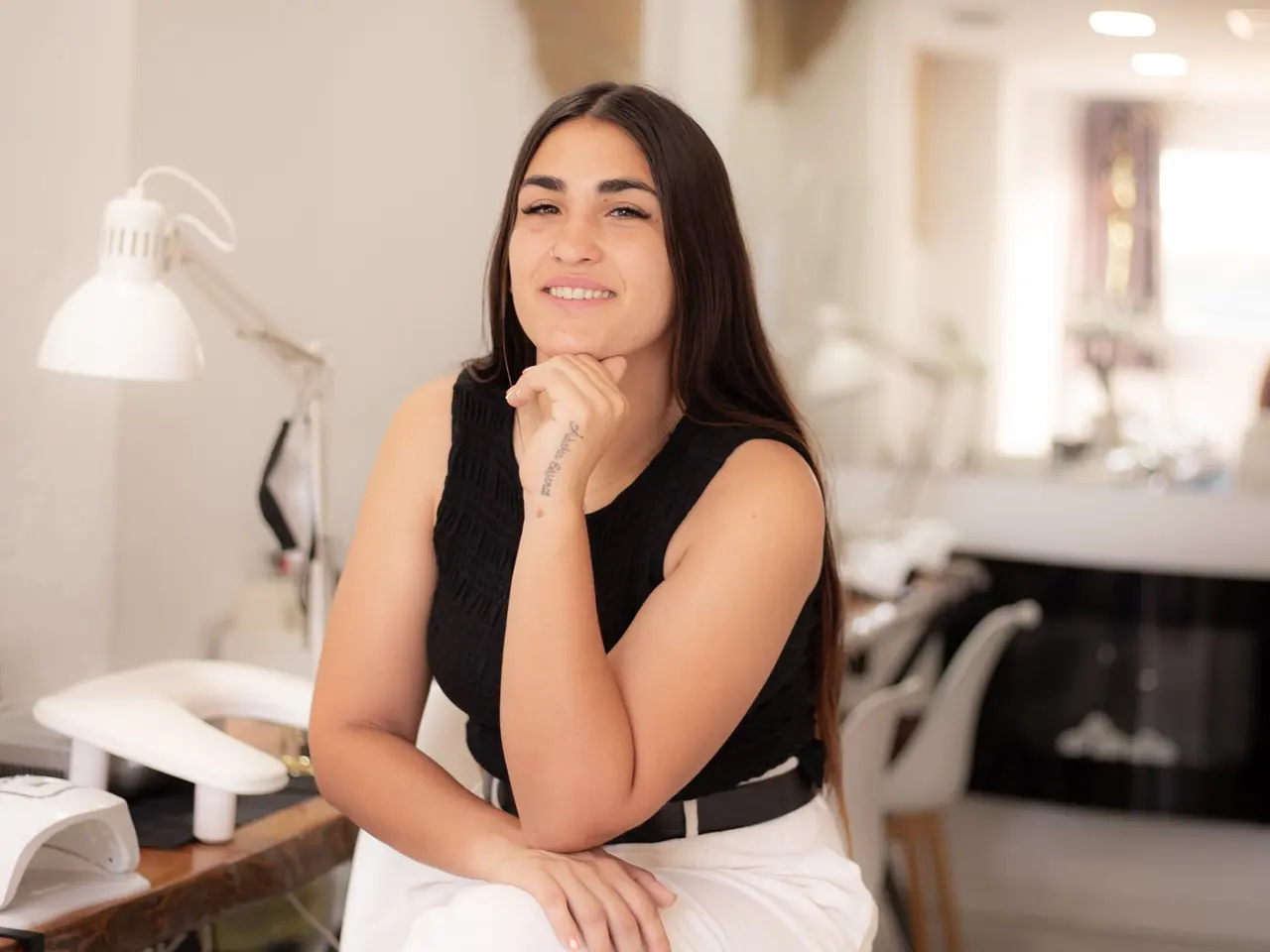 Marta in the manicure area of the centre